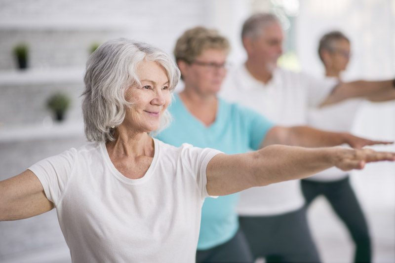Riverview Hospice and Palliative Care LLC | Older group of men and women stretching and exercising